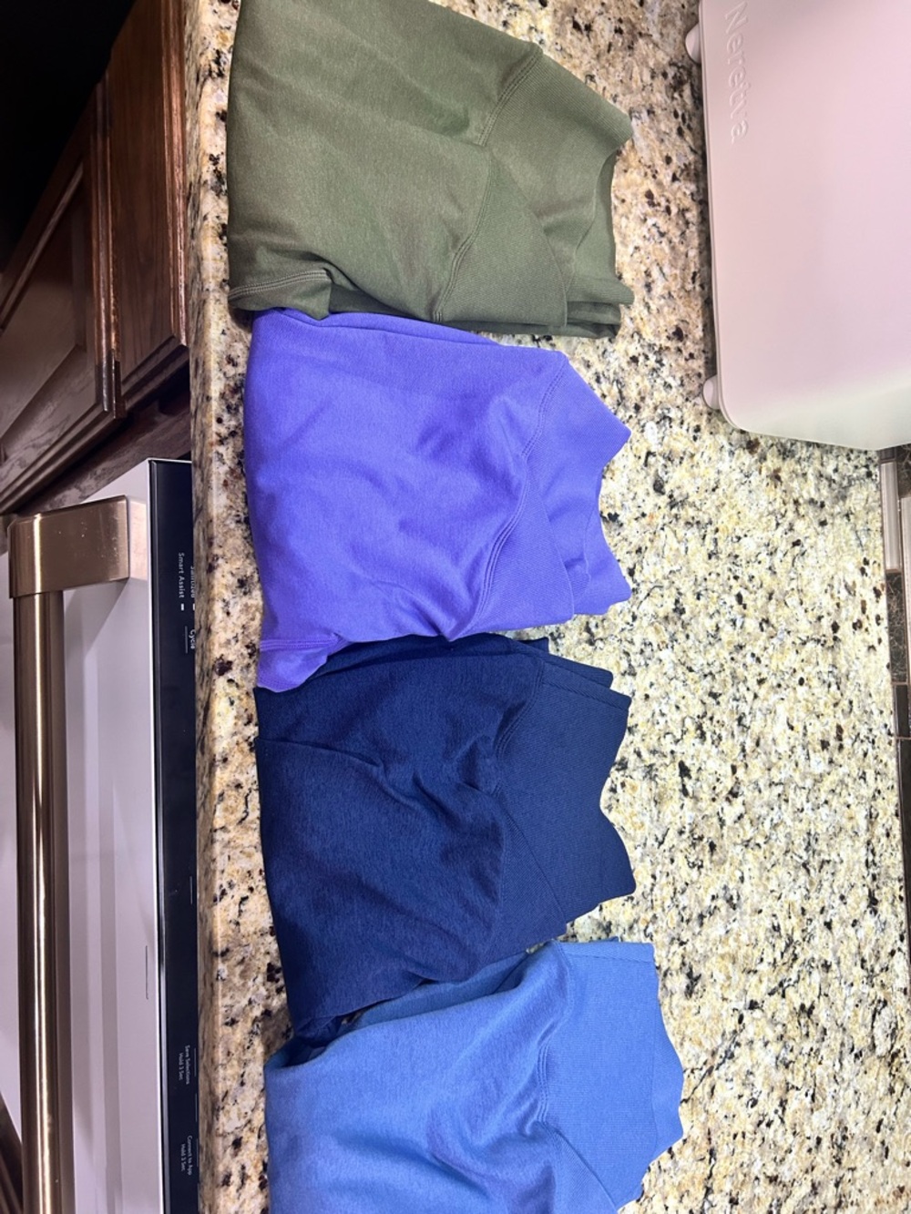 Pack of 4 leggings with butt scrunched in Olive, Purple, Navy and Periwinkle.